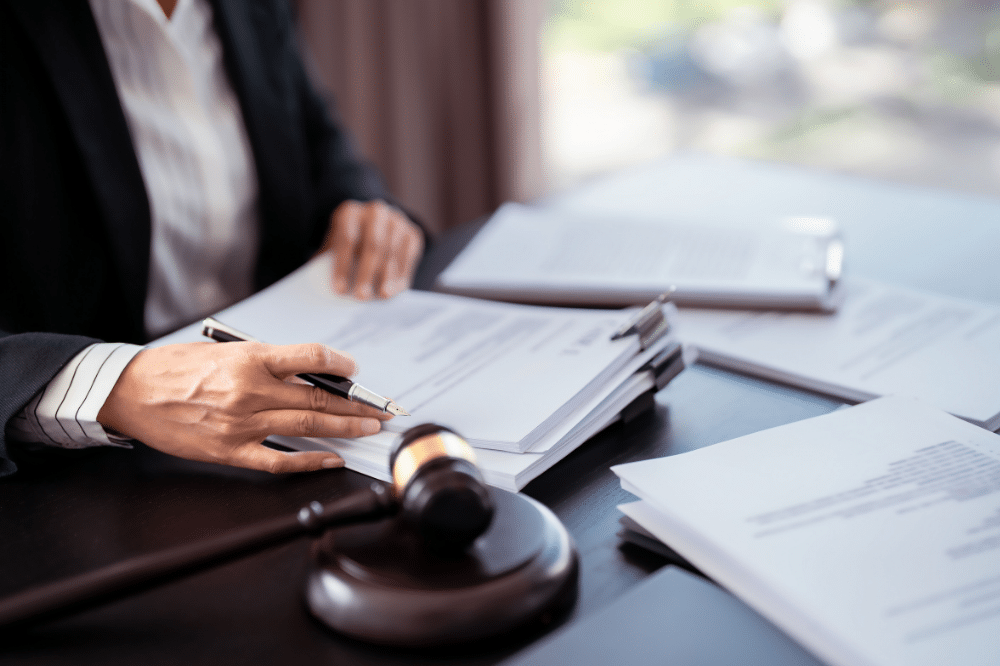 stack of papers that look like a lawsuit - benefits of a registered agent