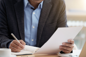 Business owner reviewing foreign qualification documents
